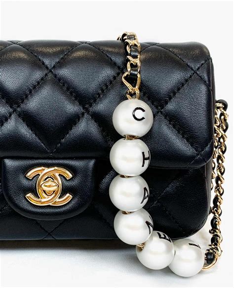 chanel small bag with pearl chain|Chanel bag with pearl chain.